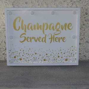 Silt “Champagne served here” LED-valgusega