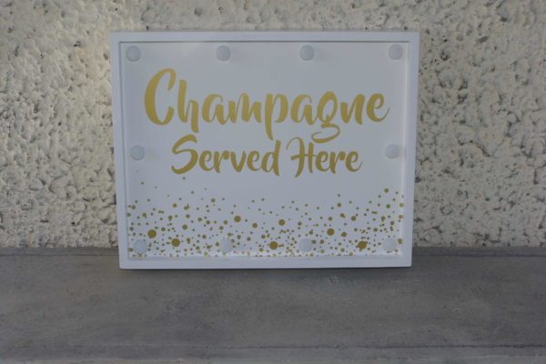 Silt "Champagne served here" LED-valgusega